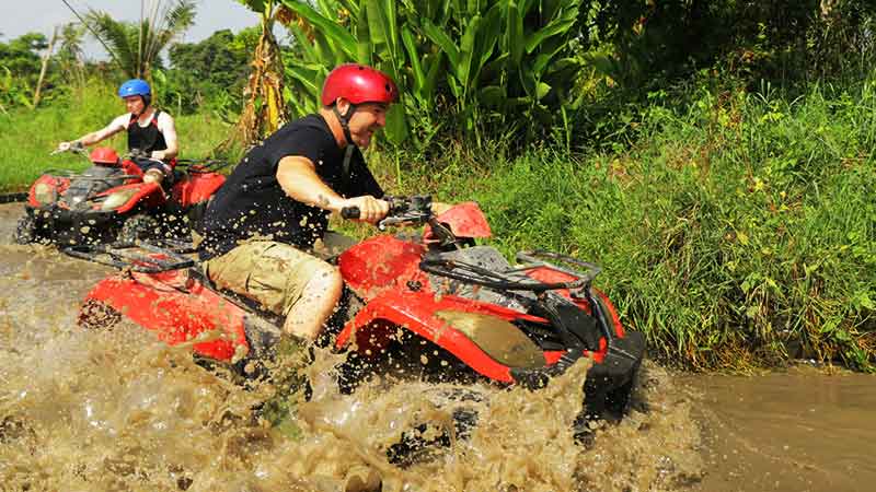 Bali ATV Ride in Ubud Through Tunnel Rice Fields Puddles